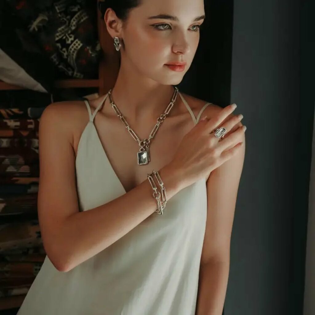A woman wearing the jewelry designs of Turkish artist Chanour Altu A woman wearing the jewelry designs of Turkish artist Chanour Altu
