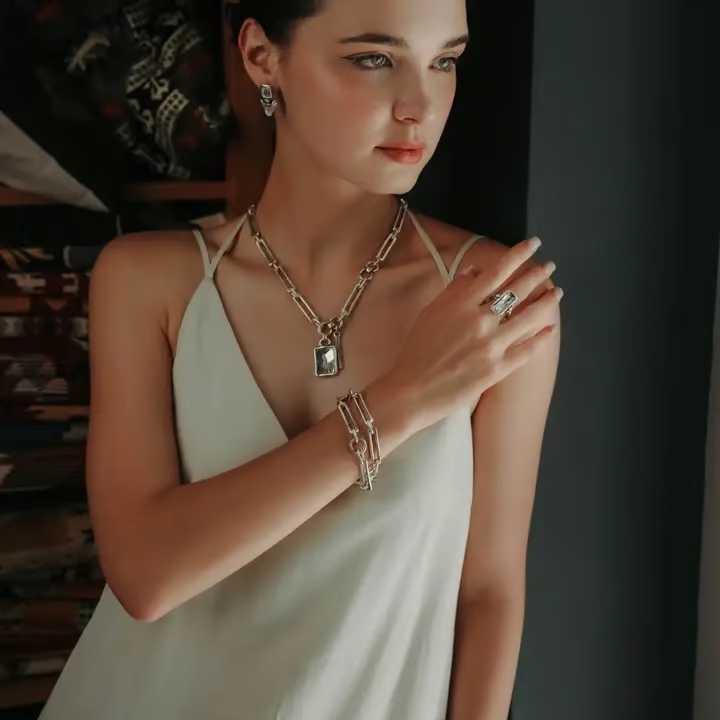 A woman wearing the jewelry designs of Turkish artist Chanour Altu