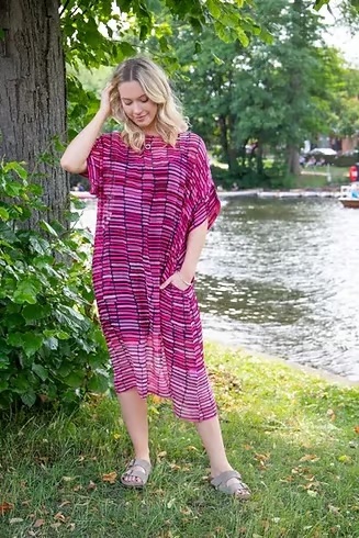 A woman wearing a dress from Yauvan.